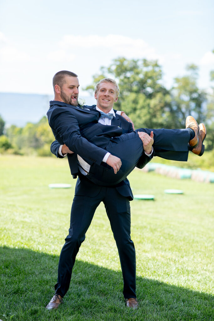 Elegant and adventurous mountain wedding at Stoneyman Valley Ranch – bride and groom portraits with Blue Ridge Mountain views, joyful first look, fun bridal party moments, and stunning sunset photos atop Little Stoneyman Overlook.