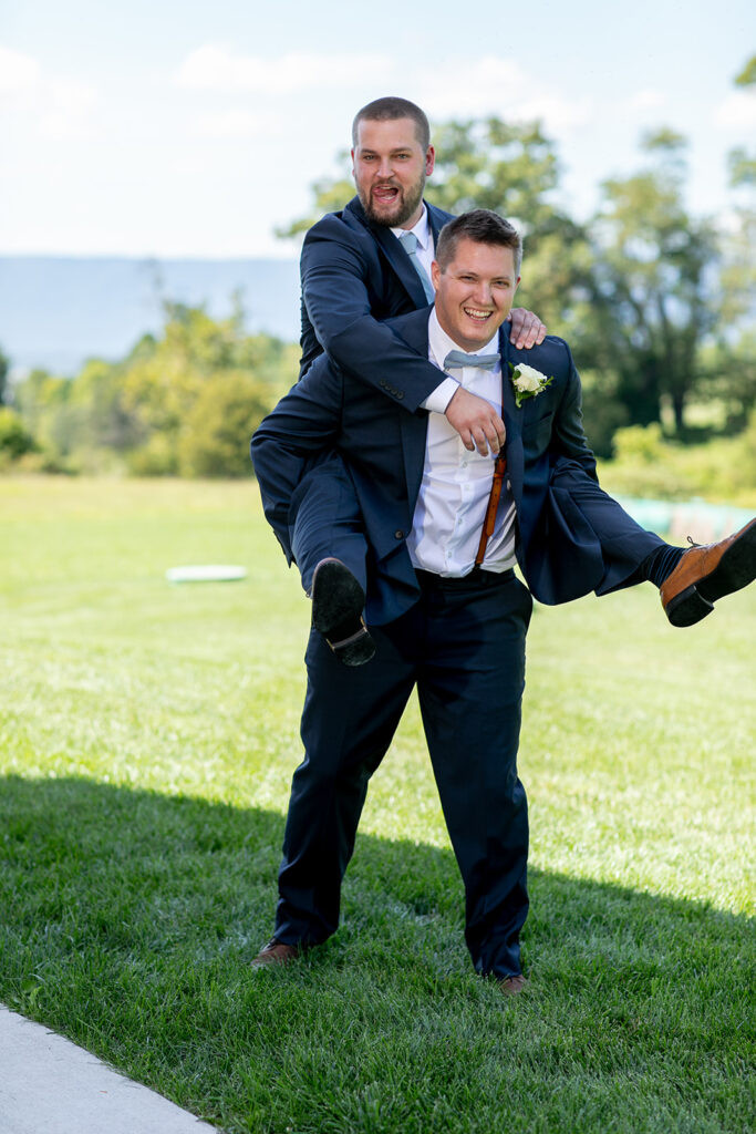 Elegant and adventurous mountain wedding at Stoneyman Valley Ranch – bride and groom portraits with Blue Ridge Mountain views, joyful first look, fun bridal party moments, and stunning sunset photos atop Little Stoneyman Overlook.