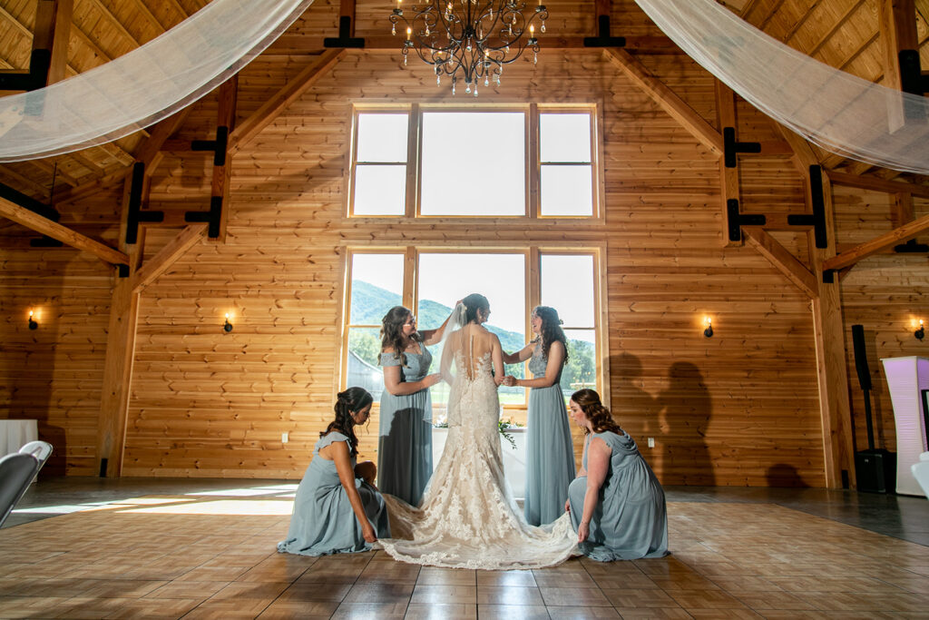 Elegant and adventurous mountain wedding at Stoneyman Valley Ranch – bride and groom portraits with Blue Ridge Mountain views, joyful first look, fun bridal party moments, and stunning sunset photos atop Little Stoneyman Overlook.