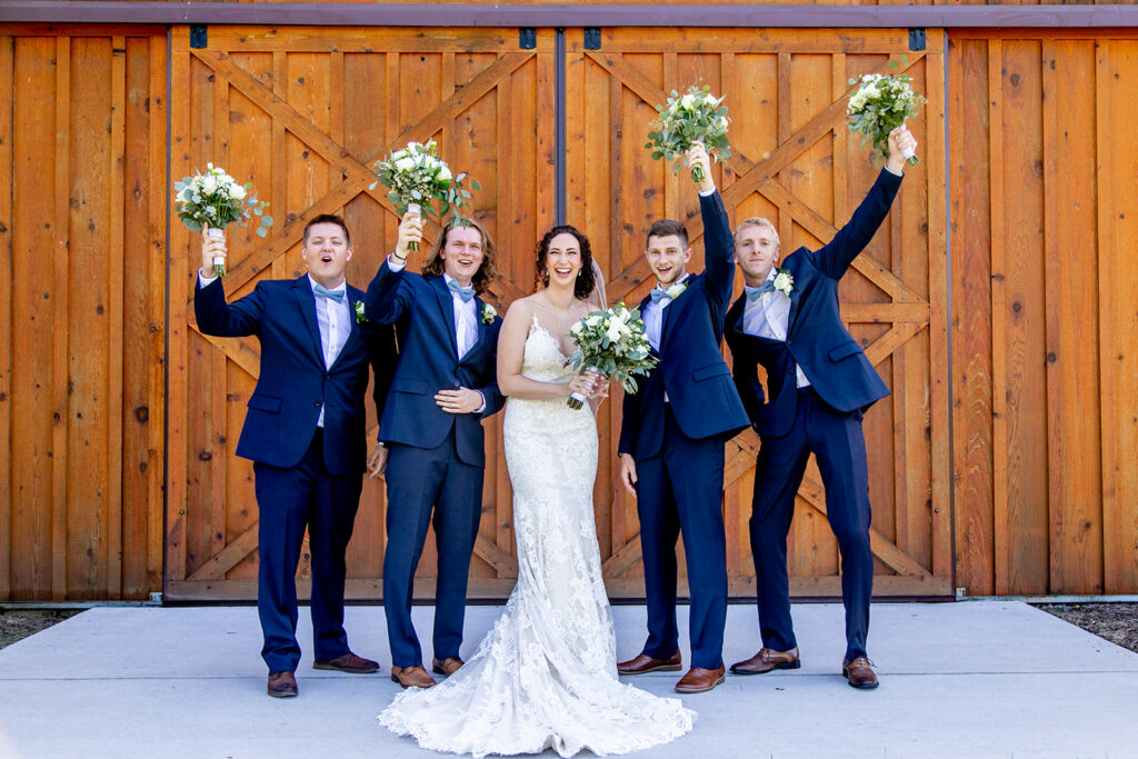 Elegant and adventurous mountain wedding at Stoneyman Valley Ranch – bride and groom portraits with Blue Ridge Mountain views, joyful first look, fun bridal party moments, and stunning sunset photos atop Little Stoneyman Overlook.