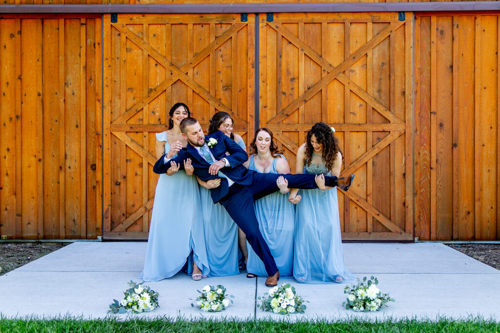 Elegant and adventurous mountain wedding at Stoneyman Valley Ranch – bride and groom portraits with Blue Ridge Mountain views, joyful first look, fun bridal party moments, and stunning sunset photos atop Little Stoneyman Overlook.