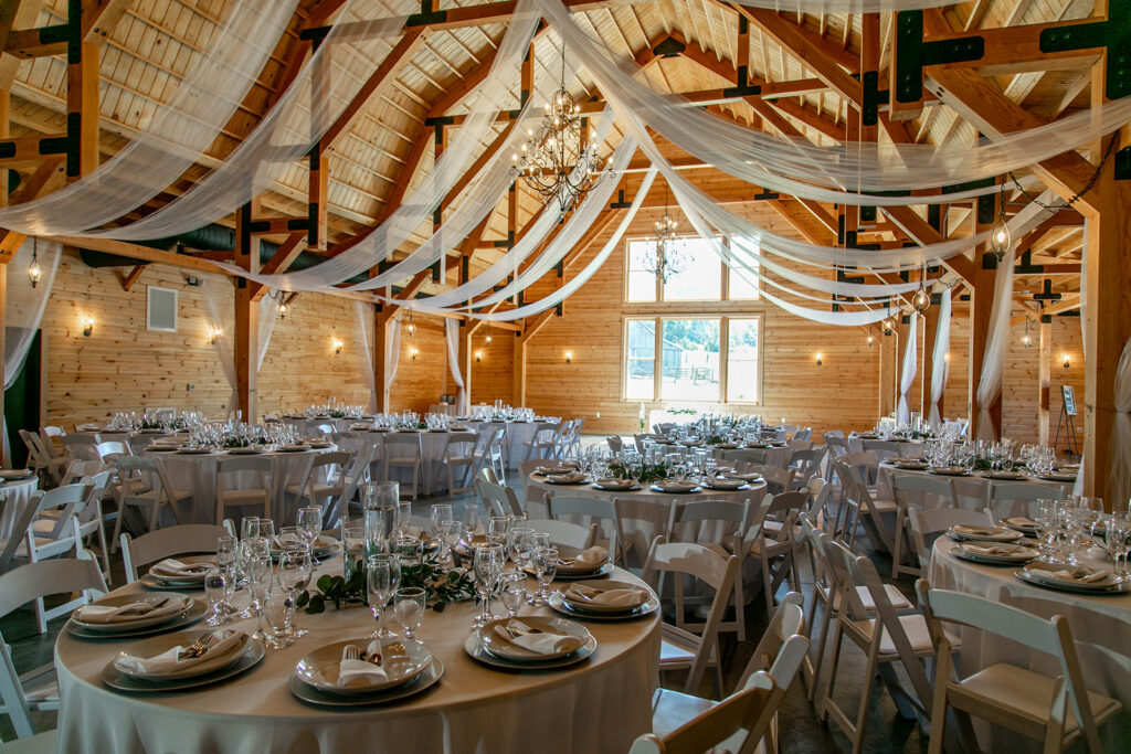 Elegant and adventurous mountain wedding at Stoneyman Valley Ranch – bride and groom portraits with Blue Ridge Mountain views, joyful first look, fun bridal party moments, and stunning sunset photos atop Little Stoneyman Overlook.