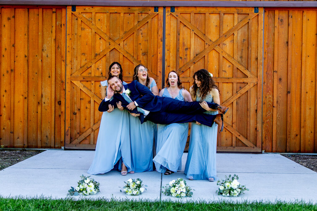 Elegant and adventurous mountain wedding at Stoneyman Valley Ranch – bride and groom portraits with Blue Ridge Mountain views, joyful first look, fun bridal party moments, and stunning sunset photos atop Little Stoneyman Overlook.