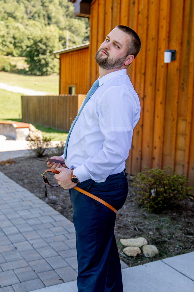 Elegant and adventurous mountain wedding at Stoneyman Valley Ranch – bride and groom portraits with Blue Ridge Mountain views, joyful first look, fun bridal party moments, and stunning sunset photos atop Little Stoneyman Overlook.