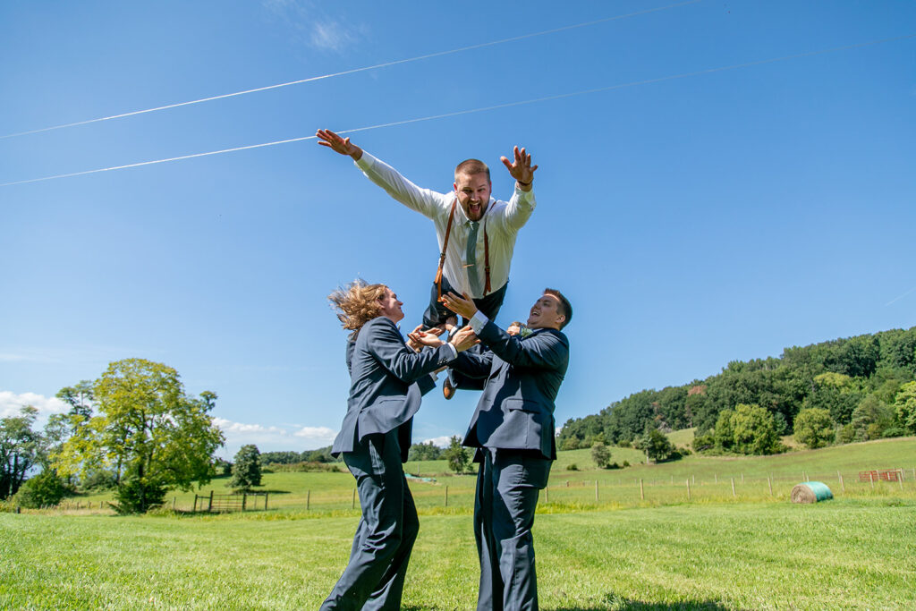 Elegant and adventurous mountain wedding at Stoneyman Valley Ranch – bride and groom portraits with Blue Ridge Mountain views, joyful first look, fun bridal party moments, and stunning sunset photos atop Little Stoneyman Overlook.