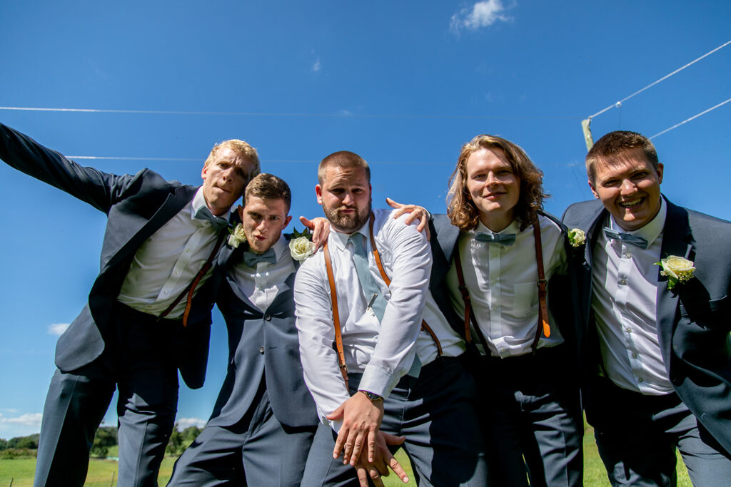 Elegant and adventurous mountain wedding at Stoneyman Valley Ranch – bride and groom portraits with Blue Ridge Mountain views, joyful first look, fun bridal party moments, and stunning sunset photos atop Little Stoneyman Overlook.