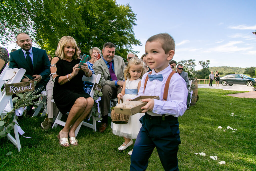 Elegant and adventurous mountain wedding at Stoneyman Valley Ranch – bride and groom portraits with Blue Ridge Mountain views, joyful first look, fun bridal party moments, and stunning sunset photos atop Little Stoneyman Overlook.