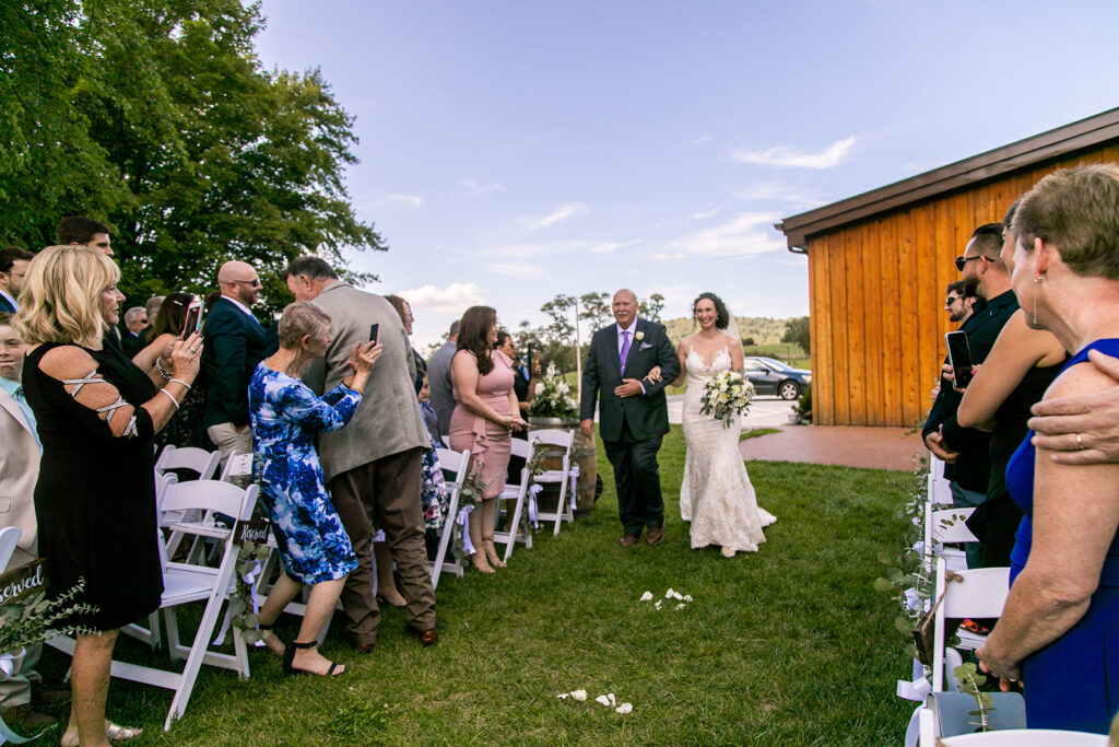 Elegant and adventurous mountain wedding at Stoneyman Valley Ranch – bride and groom portraits with Blue Ridge Mountain views, joyful first look, fun bridal party moments, and stunning sunset photos atop Little Stoneyman Overlook.