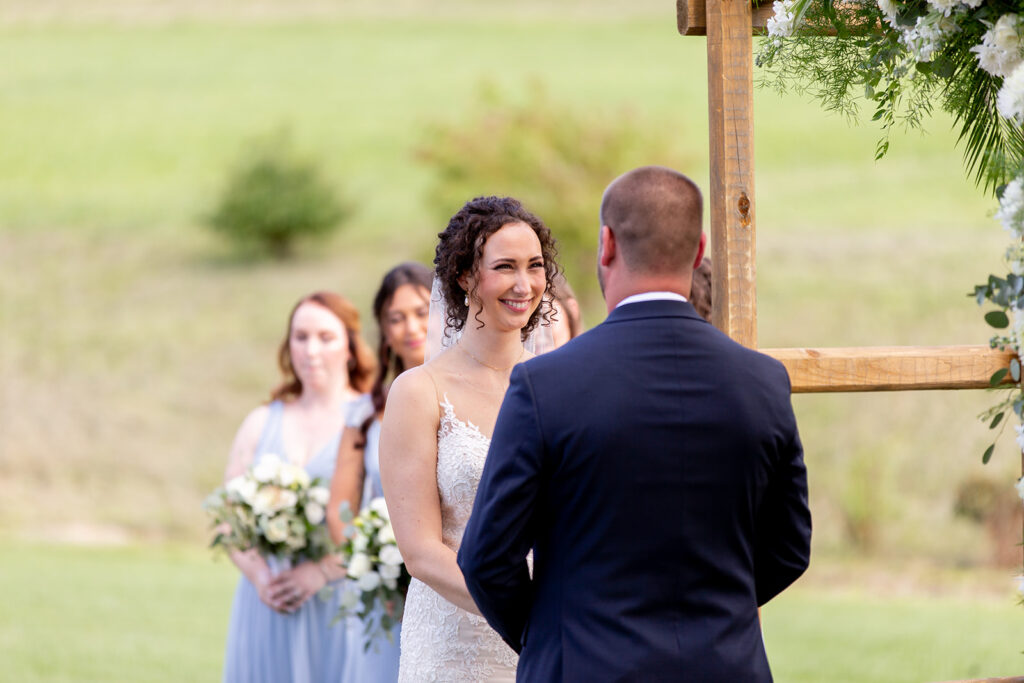 Elegant and adventurous mountain wedding at Stoneyman Valley Ranch – bride and groom portraits with Blue Ridge Mountain views, joyful first look, fun bridal party moments, and stunning sunset photos atop Little Stoneyman Overlook.