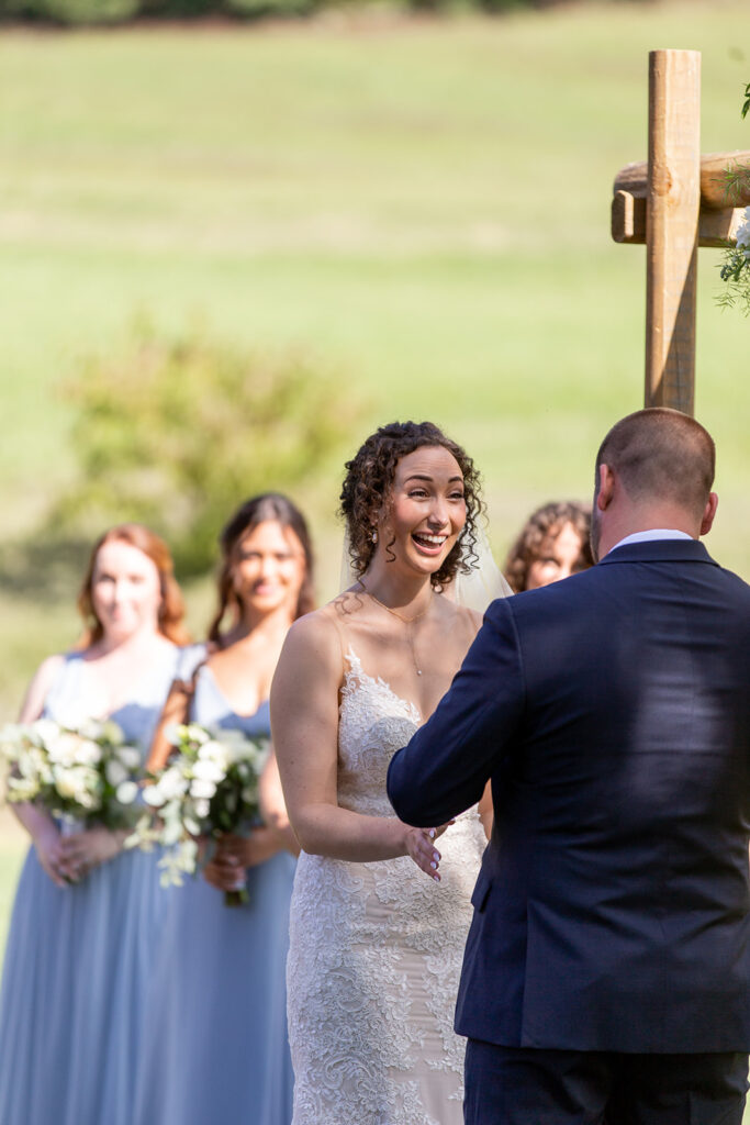 Elegant and adventurous mountain wedding at Stoneyman Valley Ranch – bride and groom portraits with Blue Ridge Mountain views, joyful first look, fun bridal party moments, and stunning sunset photos atop Little Stoneyman Overlook.