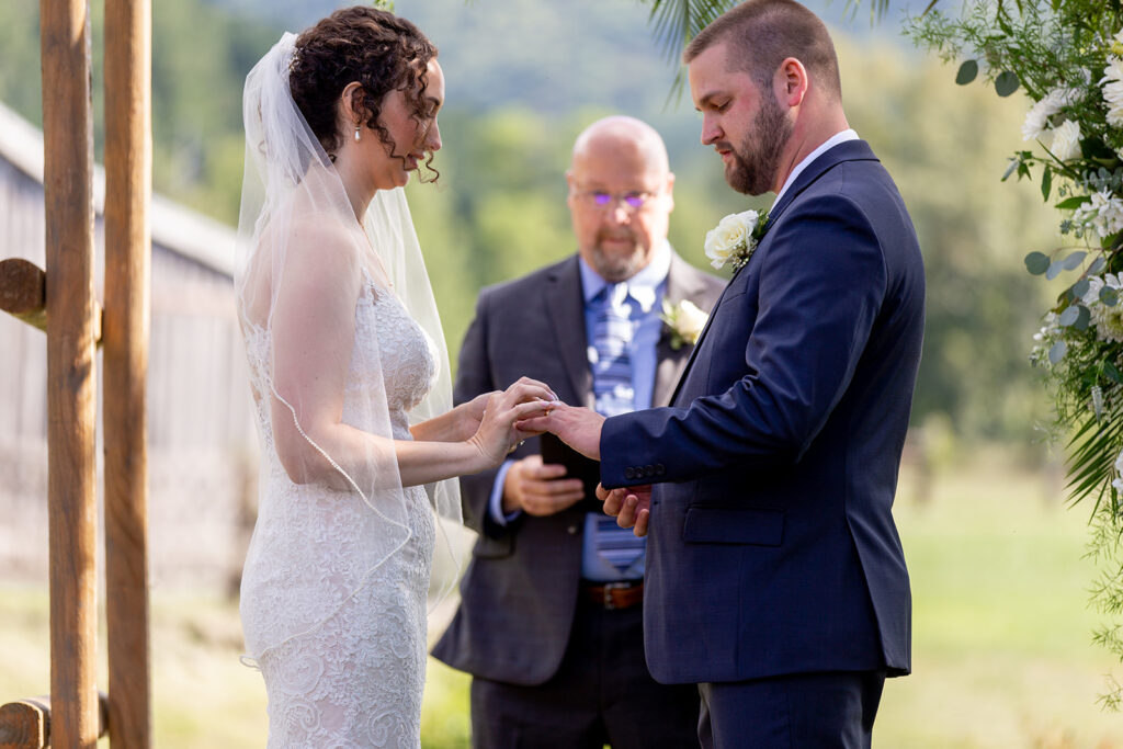 Elegant and adventurous mountain wedding at Stoneyman Valley Ranch – bride and groom portraits with Blue Ridge Mountain views, joyful first look, fun bridal party moments, and stunning sunset photos atop Little Stoneyman Overlook.