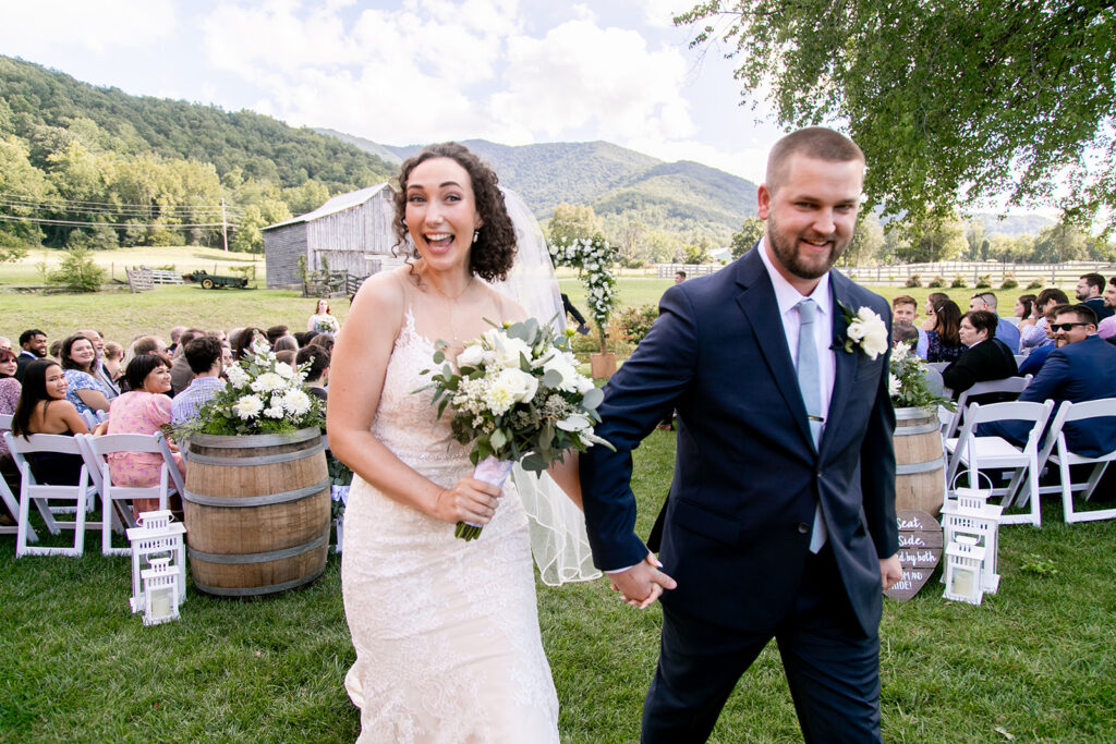 Elegant and adventurous mountain wedding at Stoneyman Valley Ranch – bride and groom portraits with Blue Ridge Mountain views, joyful first look, fun bridal party moments, and stunning sunset photos atop Little Stoneyman Overlook.