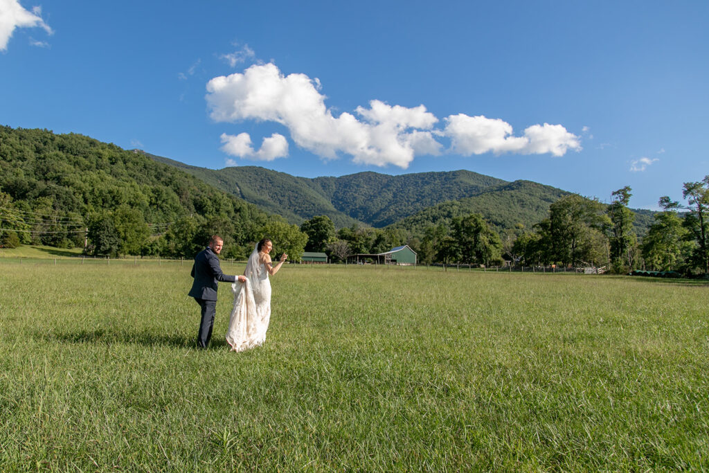 Elegant and adventurous mountain wedding at Stoneyman Valley Ranch – bride and groom portraits with Blue Ridge Mountain views, joyful first look, fun bridal party moments, and stunning sunset photos atop Little Stoneyman Overlook.