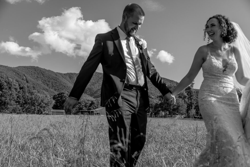 Elegant and adventurous mountain wedding at Stoneyman Valley Ranch – bride and groom portraits with Blue Ridge Mountain views, joyful first look, fun bridal party moments, and stunning sunset photos atop Little Stoneyman Overlook.