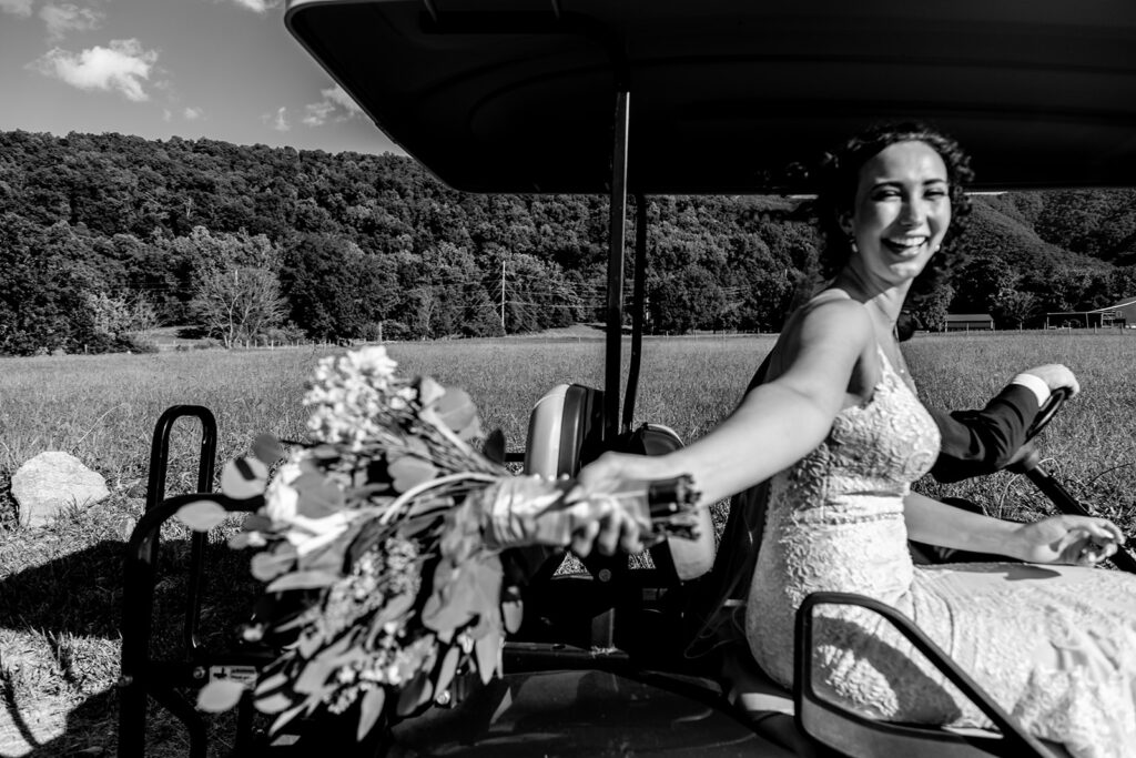 Elegant and adventurous mountain wedding at Stoneyman Valley Ranch – bride and groom portraits with Blue Ridge Mountain views, joyful first look, fun bridal party moments, and stunning sunset photos atop Little Stoneyman Overlook.