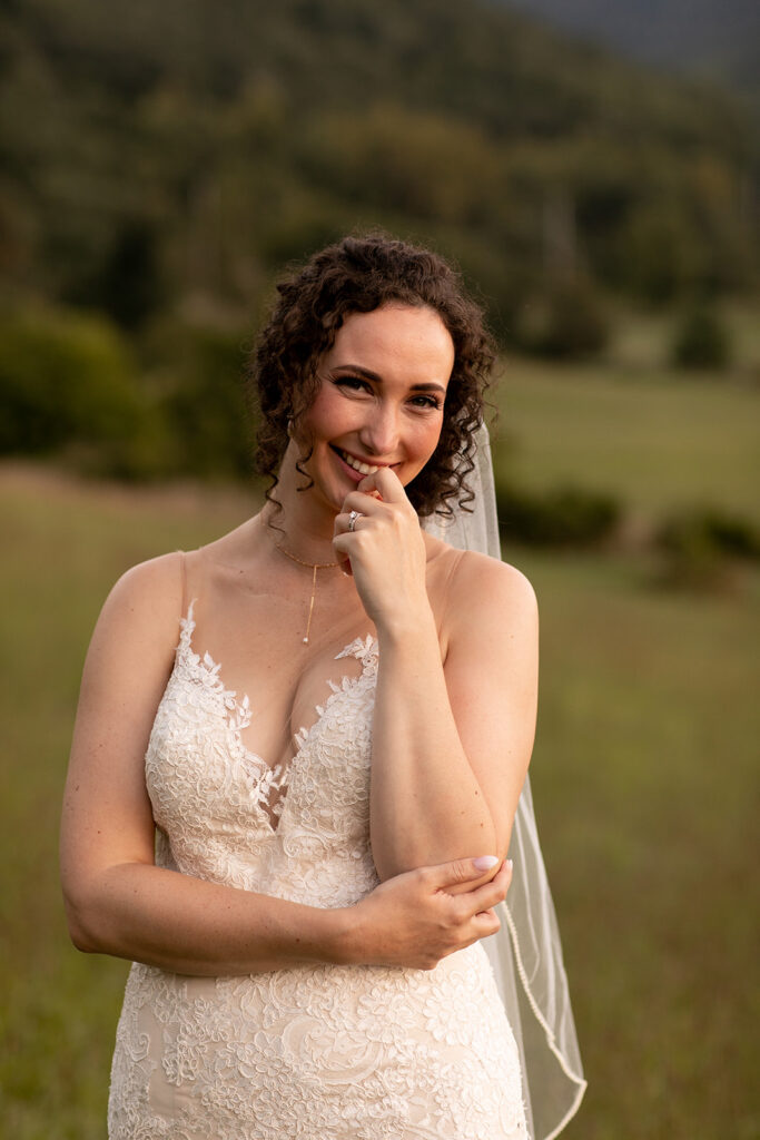 Elegant and adventurous mountain wedding at Stoneyman Valley Ranch – bride and groom portraits with Blue Ridge Mountain views, joyful first look, fun bridal party moments, and stunning sunset photos atop Little Stoneyman Overlook.