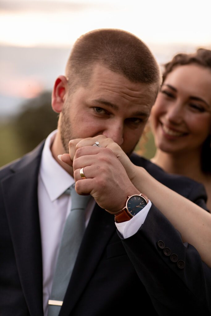 Elegant and adventurous mountain wedding at Stoneyman Valley Ranch – bride and groom portraits with Blue Ridge Mountain views, joyful first look, fun bridal party moments, and stunning sunset photos atop Little Stoneyman Overlook.