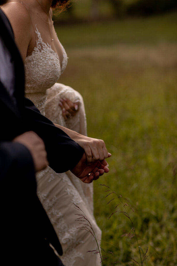 Elegant and adventurous mountain wedding at Stoneyman Valley Ranch – bride and groom portraits with Blue Ridge Mountain views, joyful first look, fun bridal party moments, and stunning sunset photos atop Little Stoneyman Overlook.