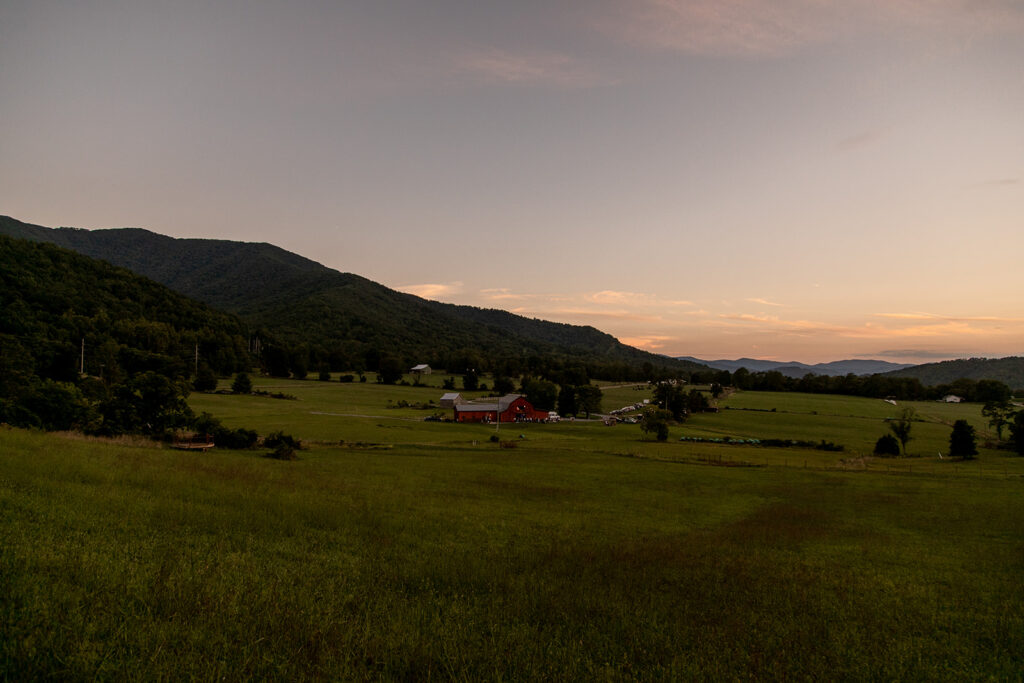 Elegant and adventurous mountain wedding at Stoneyman Valley Ranch – bride and groom portraits with Blue Ridge Mountain views, joyful first look, fun bridal party moments, and stunning sunset photos atop Little Stoneyman Overlook.