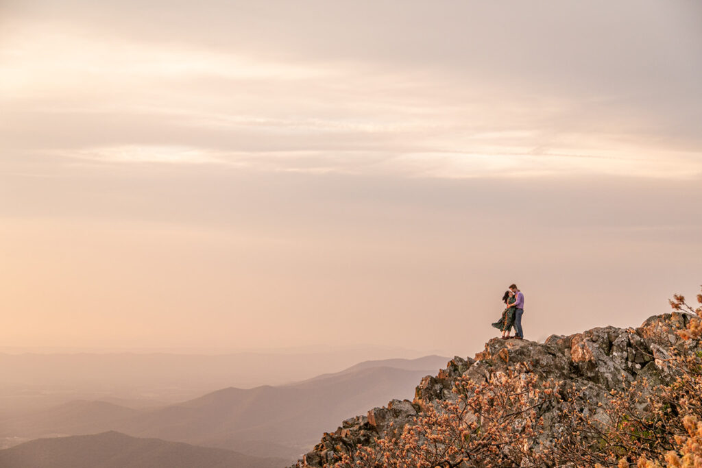 Brett and Laura stand strong together as mountain winds sweep across the rugged Shenandoah landscape.