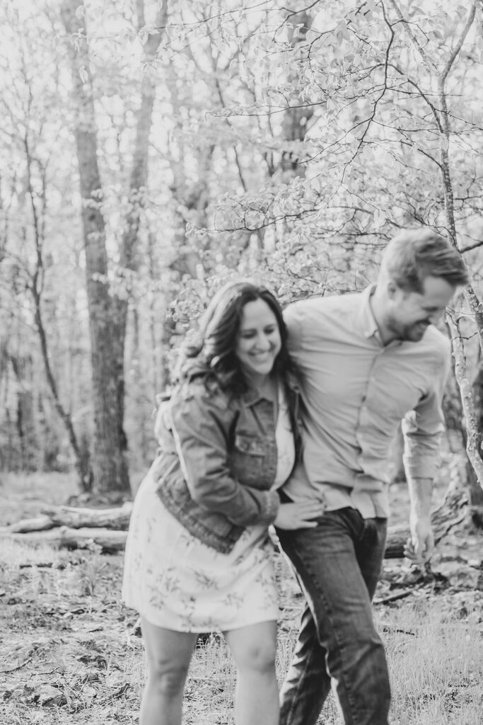 Brett and Laura share a candid, laughter-filled moment during their mountain engagement session.