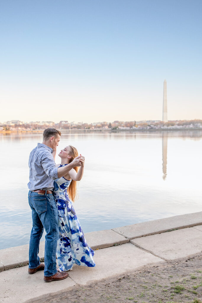 Romantic sunrise engagement session at the Tidal Basin with cherry blossoms in full bloom