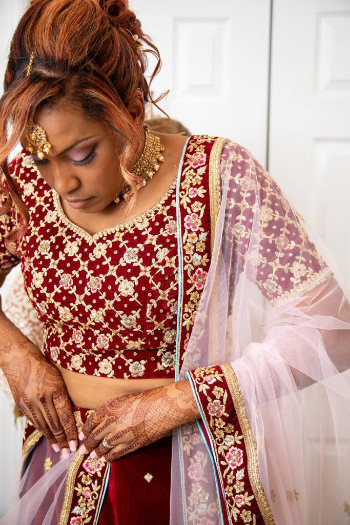 candid moment of Indian bride getting ready for her wedding ceremony