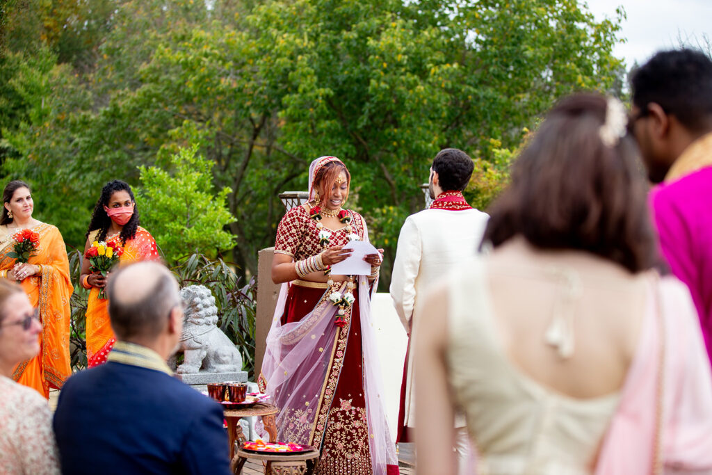 Bride and groom exchanging vows at The Butterfly Field wedding venue in Woodford, VA