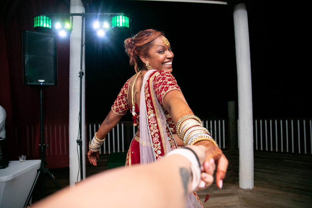 candid photo of Bride enjoying dancing at her wedding reception