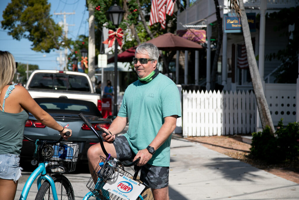 Groom enjoys a bike ride with the family the day before his wedding day