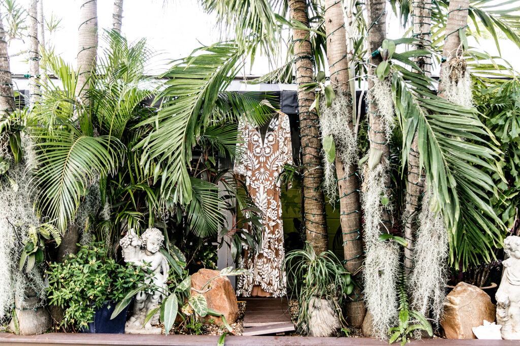 Wedding dress hung in tropical foliage at the La Te Da in Key West