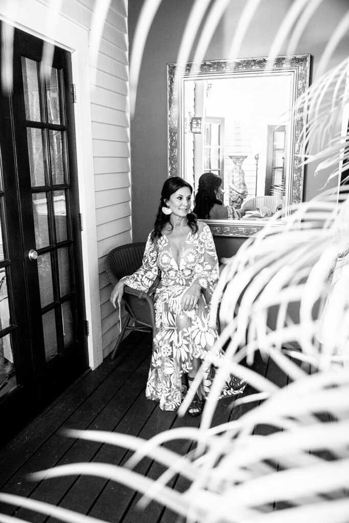 A candid and elegant black and white photo of the bride patiently waiting for her first look at her destination wedding in Key West