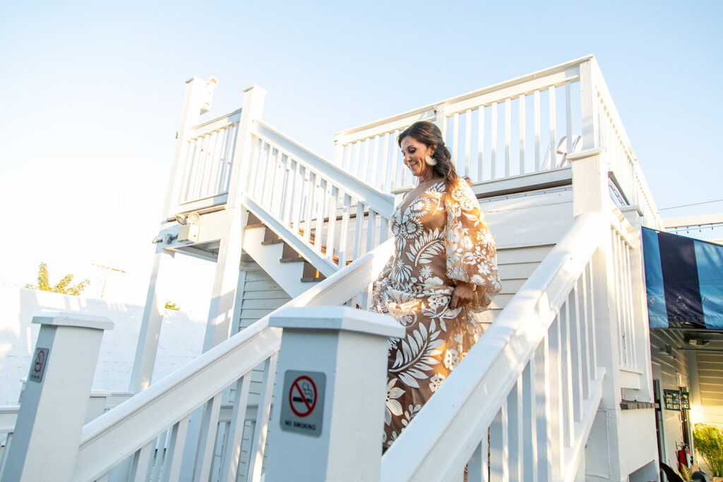 Bride coming down the stairs to see her soon to be husband
