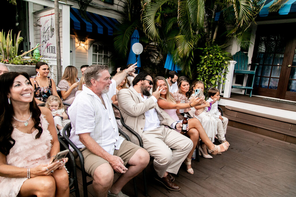 friends and family excitedly wait for the ceremony to start