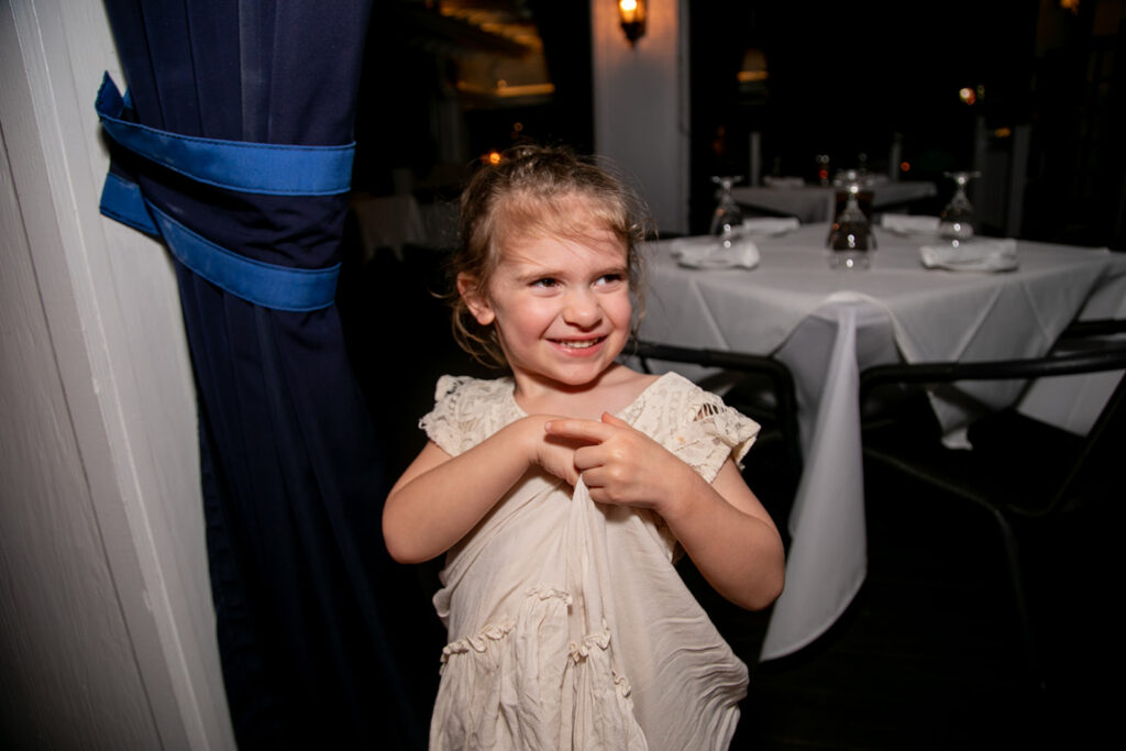 Groom's granddaughter laughing at the reception