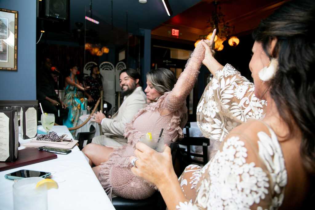 Bride encourages her daughter to dance