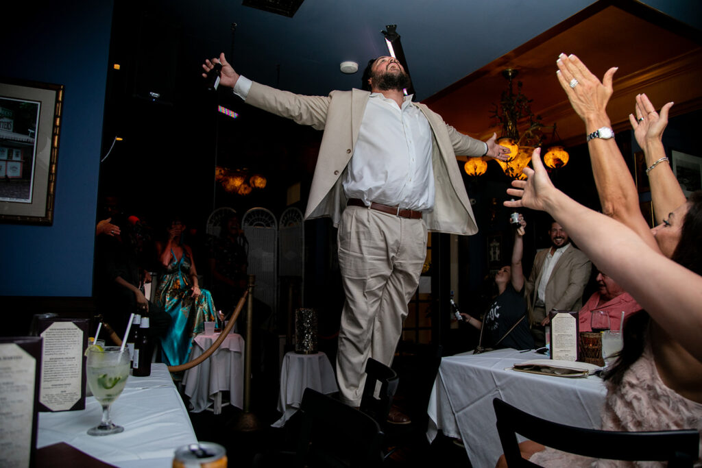 Bride's son sings to the entire restaurant while standing on a chair