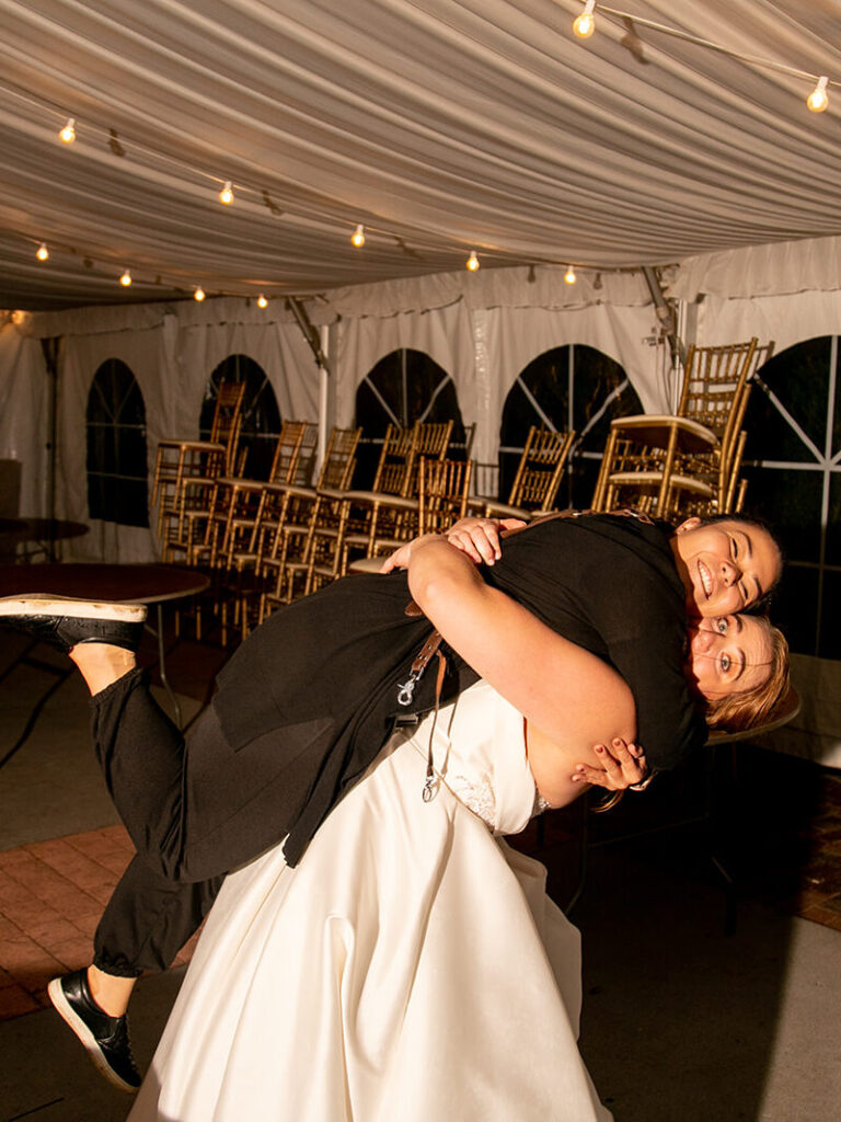 Virginia wedding photographer being embraced by one of her clients