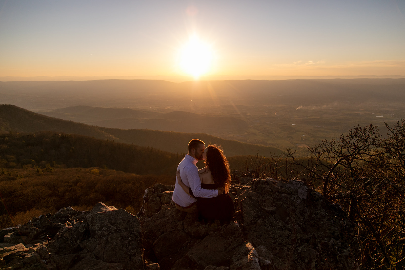 DC couple kissing at sunset with sweeping Shenandoah Valley views behind them