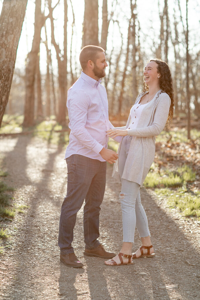 DC couple laughing together in casual outfits 