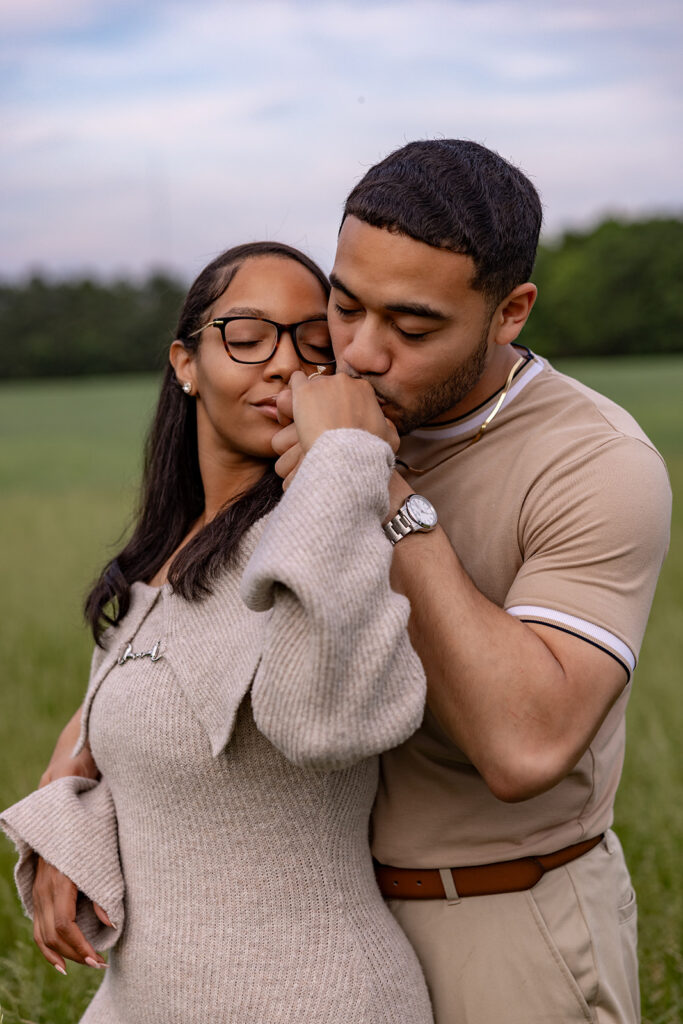 Candid engagement photo of a couple sharing a quiet moment after a surprise proposal near Washington DC