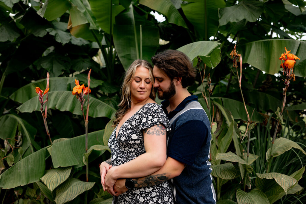 Romantic engagement photo of a couple holding each other after a surprise proposal at Meadowlark Gardens outside of Washington DC
