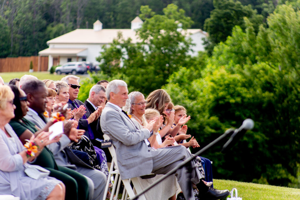 Guests applauding during the outdoor ceremony at The Seclusion.