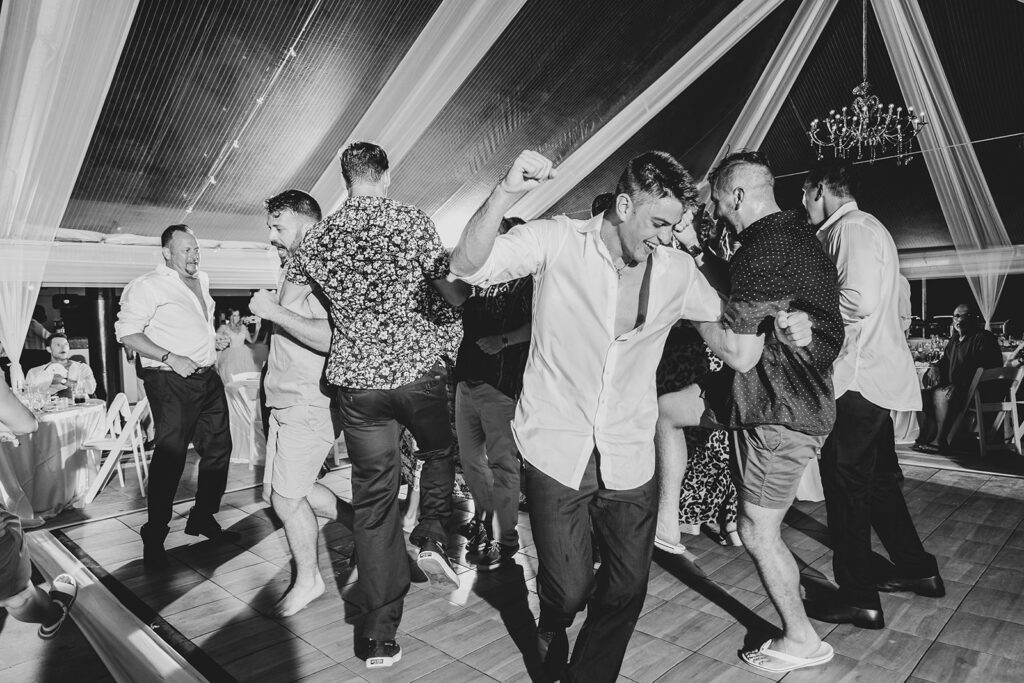Friends dancing together during the lively reception party.