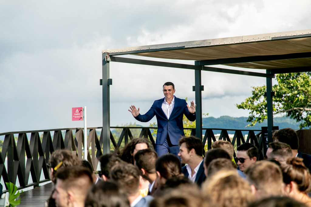 Groom greeting guests with open arms before the ceremony at the Royalton Negril resort.