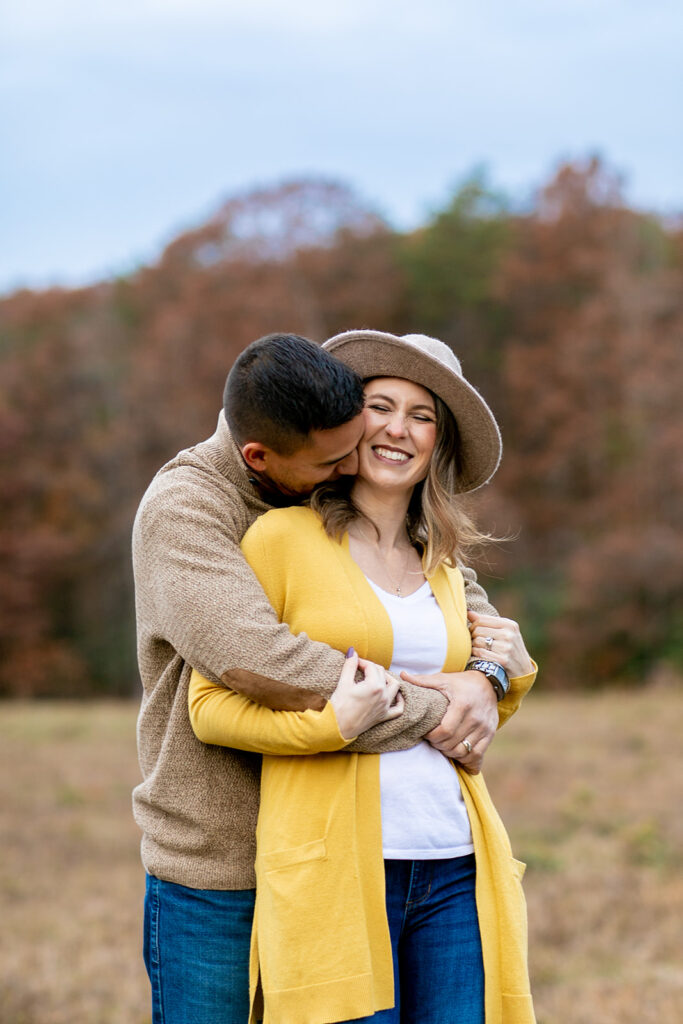 husband and wife embrace for a mini session