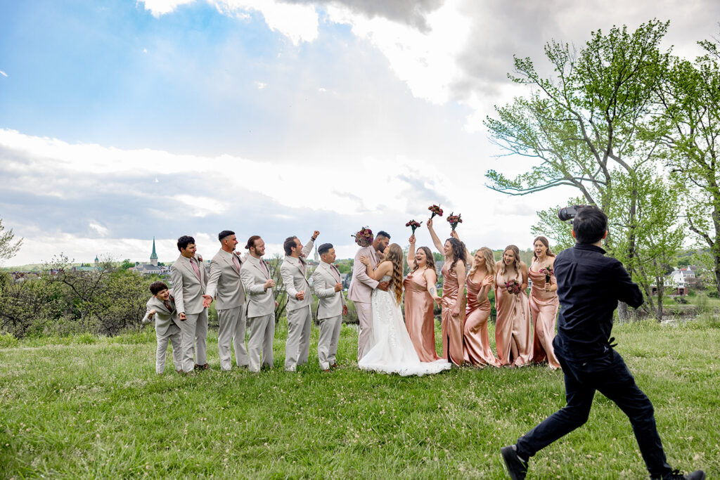 Wedding photography and videography team capturing a joyful wedding celebration