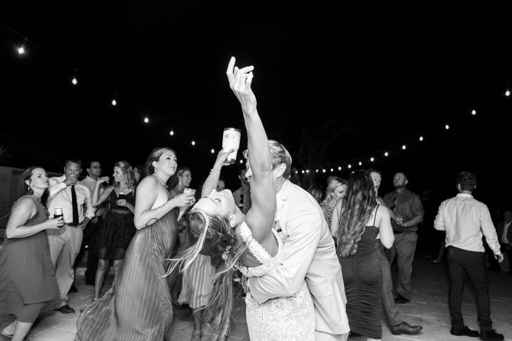 Candid dancing and joyful moments at an Ocean City backyard wedding reception