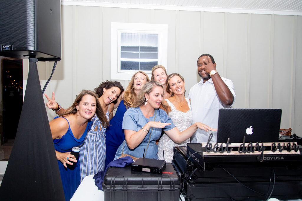 Candid dancing and joyful moments at an Ocean City backyard wedding reception