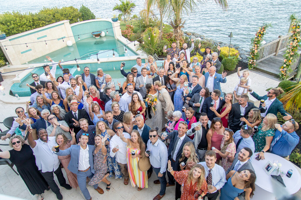 Guests wearing bright colors at a joyful Ocean City beach wedding